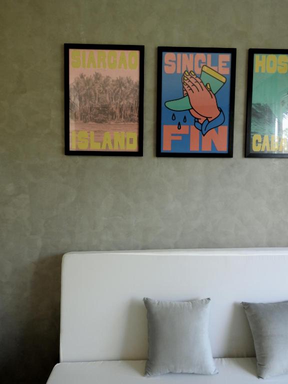 Single Fin lounge area with Siargao Island and Single Fin artwork on wall